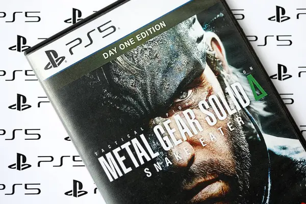 stock image KYIV, UKRAINE - JUNE 26, 2024 Metal Gear Solid Delta Snake Eater PS5 video game disc box for console gaming. Popular video game disc close up
