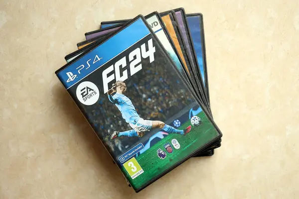 stock image KYIV, UKRAINE - JUNE 26, 2024 FC24 Fifa soccer PS4 video game disc box for console gaming. Popular video game disc close up