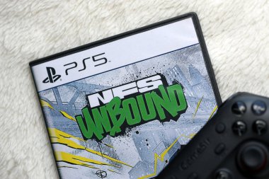 KYIV, UKRAINE - JUNE 26, 2024 Need For Speed Unbound PS5 video game disc box for console gaming. Popular video game disc close up clipart