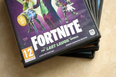 KYIV, UKRAINE - JUNE 26, 2024 Fortnite Last Laugh bundle PS5 video game disc box for console gaming. Popular video game disc close up clipart