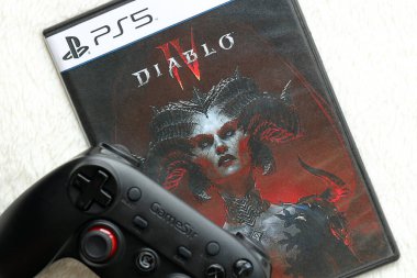 KYIV, UKRAINE - JUNE 26, 2024 Diablo 4 PS5 video game disc box for console gaming. Popular video game disc close up clipart