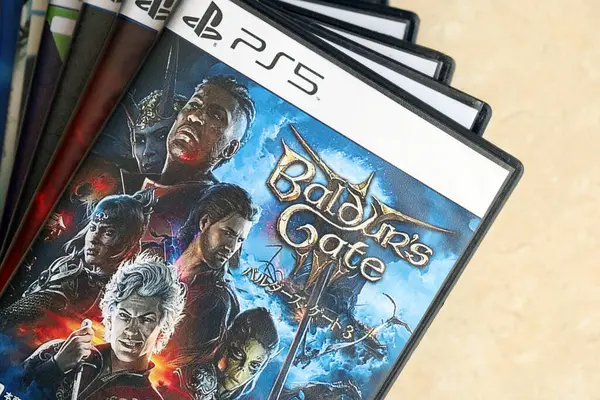 stock image KYIV, UKRAINE - JUNE 26, 2024 Baldurs Gate 3 PS5 video game disc box for console gaming. Popular video game disc close up