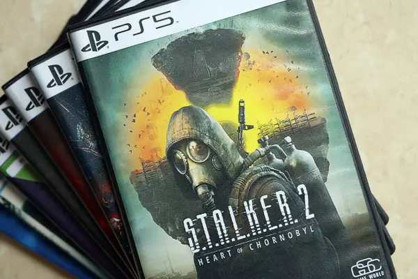 stock image KYIV, UKRAINE - JUNE 26, 2024 Stalker 2 PS5 video game disc box for console gaming. Fictional fan-made popular video game disc close up