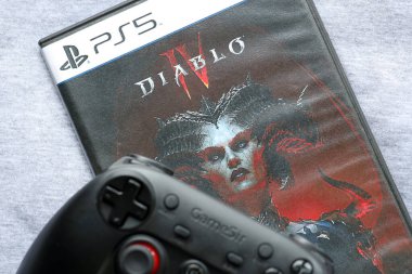 KYIV, UKRAINE - JUNE 26, 2024 Diablo 4 PS5 video game disc box for console gaming. Popular video game disc close up clipart