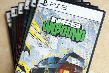 KYIV, UKRAINE - JUNE 26, 2024 Need For Speed Unbound PS5 video game disc box for console gaming. Popular video game disc close up clipart