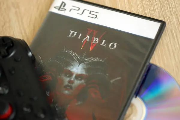 stock image KYIV, UKRAINE - JUNE 26, 2024 Diablo 4 PS5 video game disc box for console gaming. Popular video game disc close up