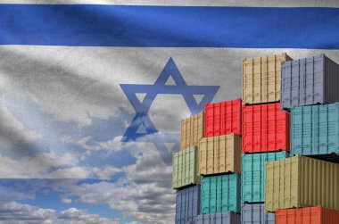 Israel flag and big stack of shipping cargo containers in docks with sky background close up clipart