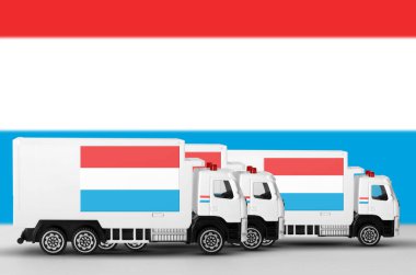 Luxembourg flag depicted on side wall of white delivery van close up. Shipping and local delivery concept clipart