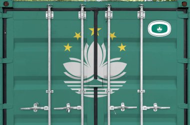 Macau flag depicted on metal doors of shipping cargo container outdoors in docks area close up clipart