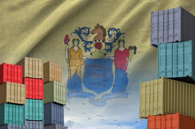 New Jersey US state flag and big stack of shipping cargo containers in docks with sky background close up clipart