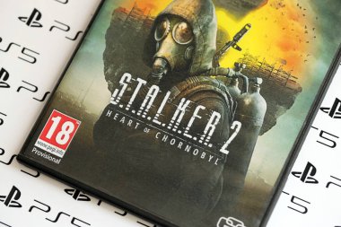 KYIV, UKRAINE - JUNE 26, 2024 Stalker 2 PS5 video game disc box for console gaming. Fictional fan-made popular video game disc close up clipart