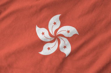 Hong kong flag depicted on folded wavy fabric of old cloth close up clipart