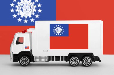 Myanmar flag depicted on side wall of white delivery van close up. Shipping and local delivery concept clipart