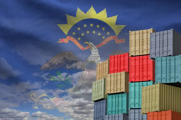 stock image North Dakota US state flag and big stack of shipping cargo containers in docks with sky background close up