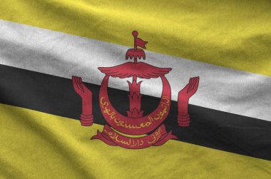 Brunei Darussalam bayrağı eski kumaşın katlanmış dalgalı kumaşında tasvir edilmiştir.