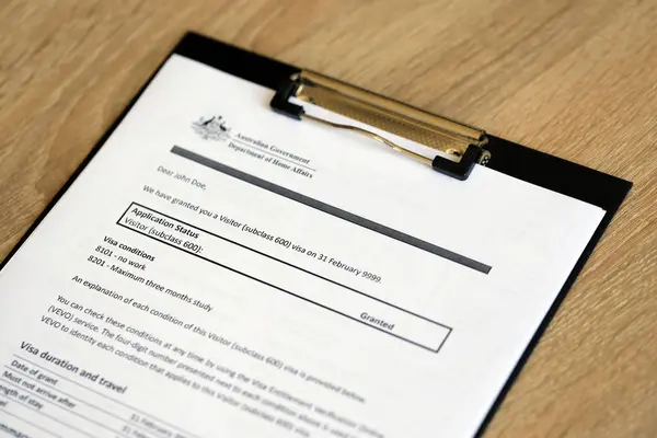 stock image KYIV, UKRAINE - JULY 10, 2024 Application status for Australian visitor visa on table of Australian Government Department of Home Affairs close up