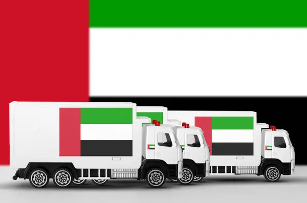 stock image United Arab Emirates flag depicted on side wall of white delivery van close up. Shipping and local delivery concept