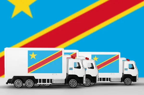 Stock image Democratic Republic of the Congo flag depicted on side wall of white delivery van close up. Shipping and local delivery concept