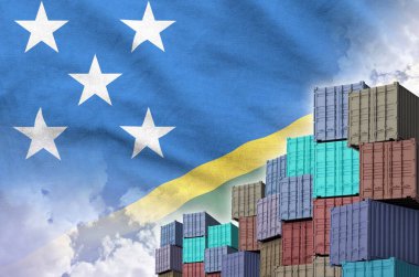 Solomon Islands flag and big stack of shipping cargo containers in docks with sky background close up clipart