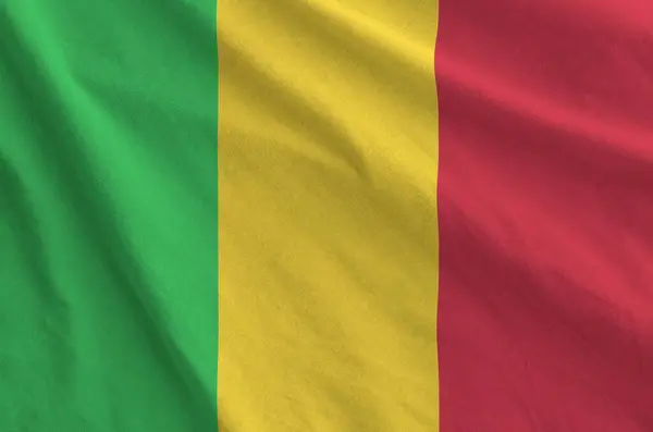 stock image Mali flag depicted on folded wavy fabric of old cloth close up