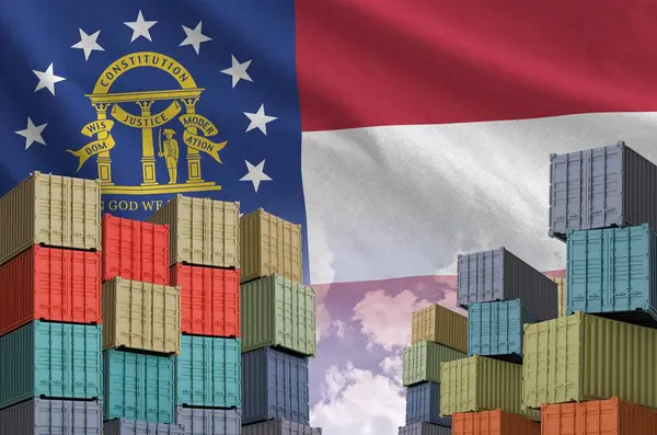 stock image Georgia US state flag and big stack of shipping cargo containers in docks with sky background close up