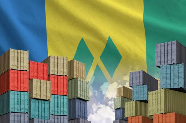 stock image Saint Vincent and the Grenadines flag and big stack of shipping cargo containers in docks with sky background close up