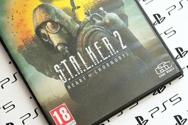 stock image KYIV, UKRAINE - JUNE 26, 2024 Stalker 2 PS5 video game disc box for console gaming. Fictional fan-made popular video game disc close up