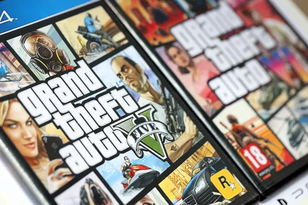 stock image KYIV, UKRAINE - JUNE 26, 2024 Grand Theft Auto Five and Six video game disc boxes. Fictional fan-made cover on plastic disc boxes close up