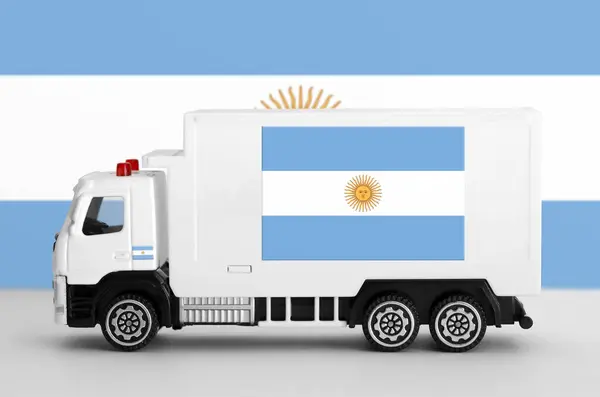 stock image Argentina flag depicted on side wall of white delivery van close up. Shipping and local delivery concept