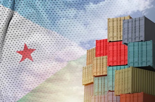 stock image Djibouti flag and big stack of shipping cargo containers in docks with sky background close up