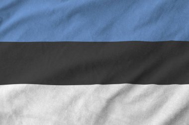 Estonya bayrağı eski kumaşların katlanmış dalgalı kumaşına çizilmiş.