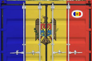 Moldova flag depicted on metal doors of shipping cargo container outdoors in docks area close up clipart