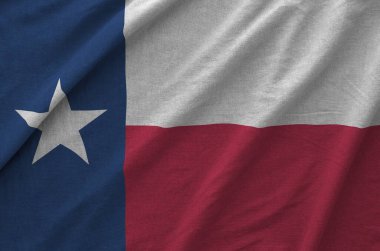 Texas US state flag depicted on folded wavy fabric of old cloth close up clipart