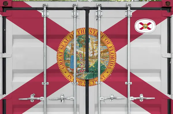 stock image Florida US state flag depicted on metal doors of shipping cargo container outdoors in docks area close up