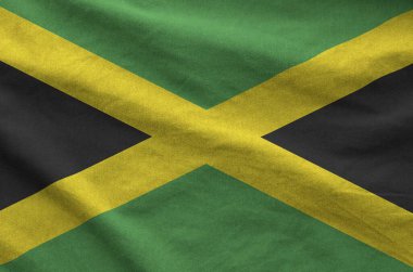 Jamaika bayrağı eski kumaştan katlanmış dalgalı kumaş üzerine çizilmiş.