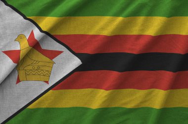 Zimbabwe bayrağı eski kumaşın kıvrımlı kumaşında tasvir edilmiştir.