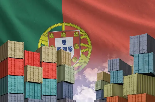 stock image Portugal flag and big stack of shipping cargo containers in docks with sky background close up