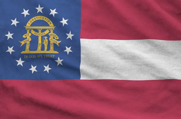 Stock image Georgia US state flag depicted on folded wavy fabric of old cloth close up