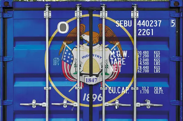 stock image Utah US state flag depicted on metal doors of shipping cargo container outdoors in docks area close up