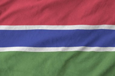 Eski kumaşların kıvrımlı kumaşında Gambiya bayrağı tasvir edilmiştir.