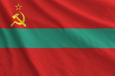 Transnistria bayrağı eski kumaşın katlanmış dalgalı kumaşında tasvir edilmiştir.