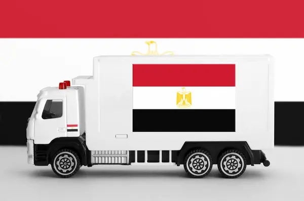 stock image Egypt flag depicted on side wall of white delivery van close up. Shipping and local delivery concept