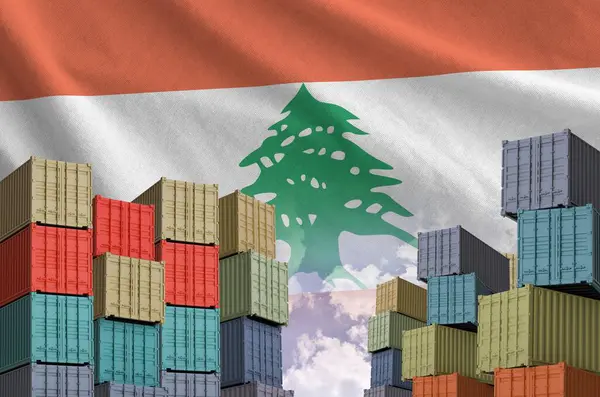 stock image Lebanon flag and big stack of shipping cargo containers in docks with sky background close up