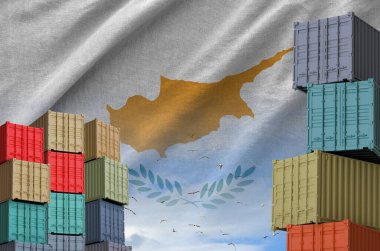 Cyprus flag and big stack of shipping cargo containers in docks with sky background close up clipart