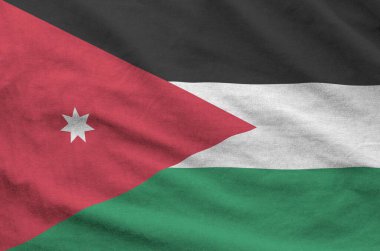 Eski kumaşın katlanmış dalgalı kumaşında Jordan bayrağı tasvir edilmiştir.