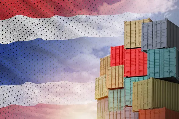 stock image Thailand flag and big stack of shipping cargo containers in docks with sky background close up