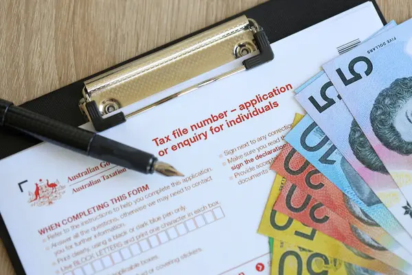 stock image KYIV, UKRAINE - JULY 10, 2024 Australian Tax File Number Application or enquiry for individuals blank form lies on table of Australian Government taxation office close up