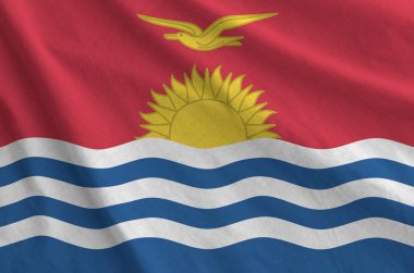 Kiribati bayrağı eski kumaşın kıvrımlı kumaşında tasvir edilmiştir.