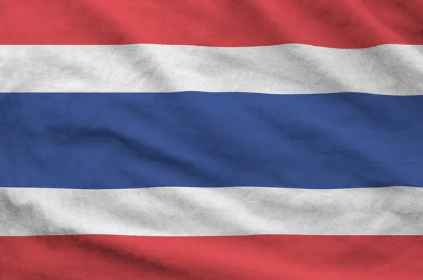 Stock image Thailand flag depicted on folded wavy fabric of old cloth close up