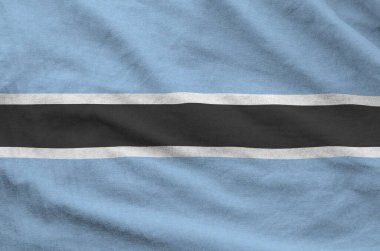 Botsvana bayrağı katlanmış eski kumaşların dalgalı kumaşında tasvir edilmiştir.